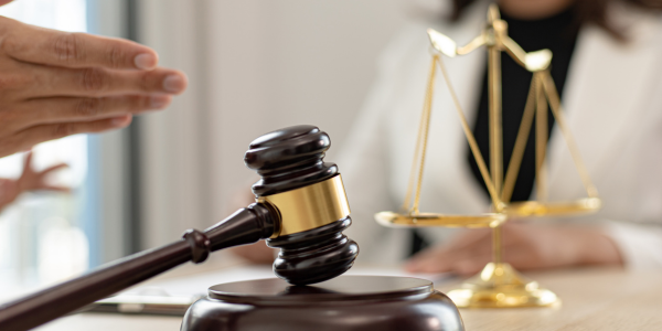 a gavel on a wooden block